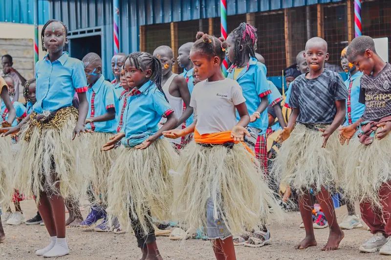 Light Academy pupils dancing in traditional costumes