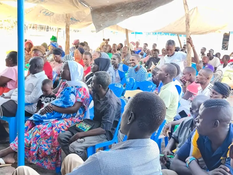 Children at Light Academy in Kalobeyei receiving educational learning materials and community support