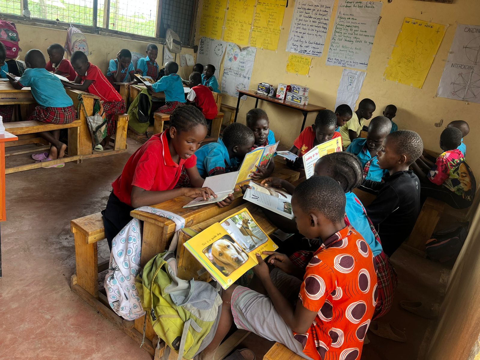 Light Academy students reading books in the classroom